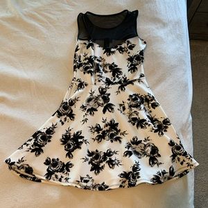 Fun short black and white dress with netted top.